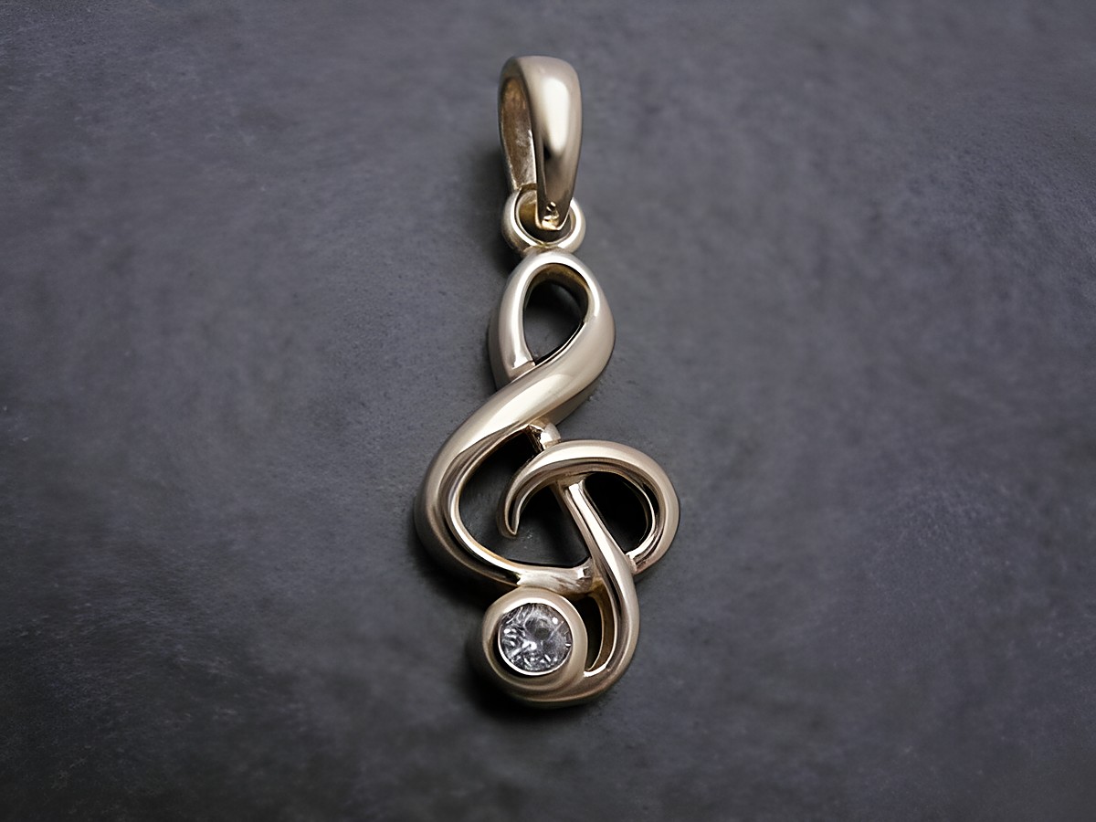 Gold Anhänger in Form eines Violinschlüssels mit Zirkonia in weiß, vom Hersteller Juwelier Harnisch, ideal für Musikliebhaber.