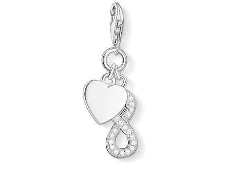 Charm von Thomas Sabo mit Infinity-Symbol und herzförmigem Anhänger, verziert mit weißen Zirkonia, symbolisiert Liebe und Unendlichkeit. Ideal als Schmuckstück für besondere Anlässe.