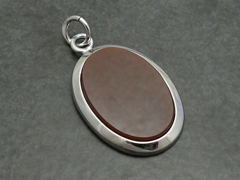 Silber Anhänger ECHT Karneol in ovaler Form, elegant verarbeitet, Hersteller Juwelier Harnisch, Karneol in warmen Brauntönen, ideal als Schmuckstück für besondere Anlässe.
