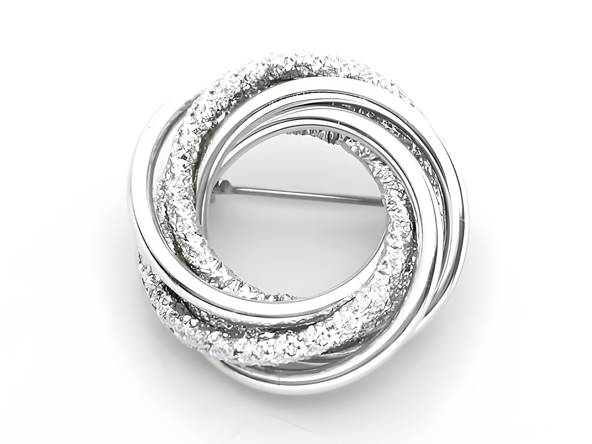 Brosche im Sexy City Look in poliertem und mattem Design, hergestellt von Juwelier Harnisch. Modischer Modeschmuck mit funkelnden Elementen, ideal für stilvolle Akzente.
