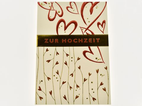Hochzeitskarte mit roten Herzen und ornamentalem Design, Hersteller Juwelier Harnisch, ideal für Hochzeitsglückwünsche.