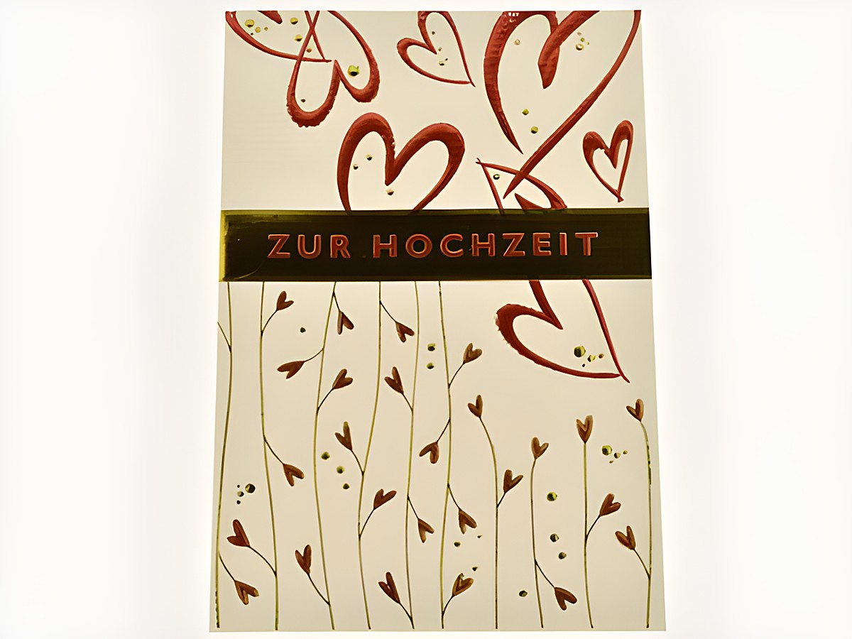 Hochzeitskarte mit roten Herzen und ornamentalem Design, Hersteller Juwelier Harnisch, ideal für Hochzeitsglückwünsche.