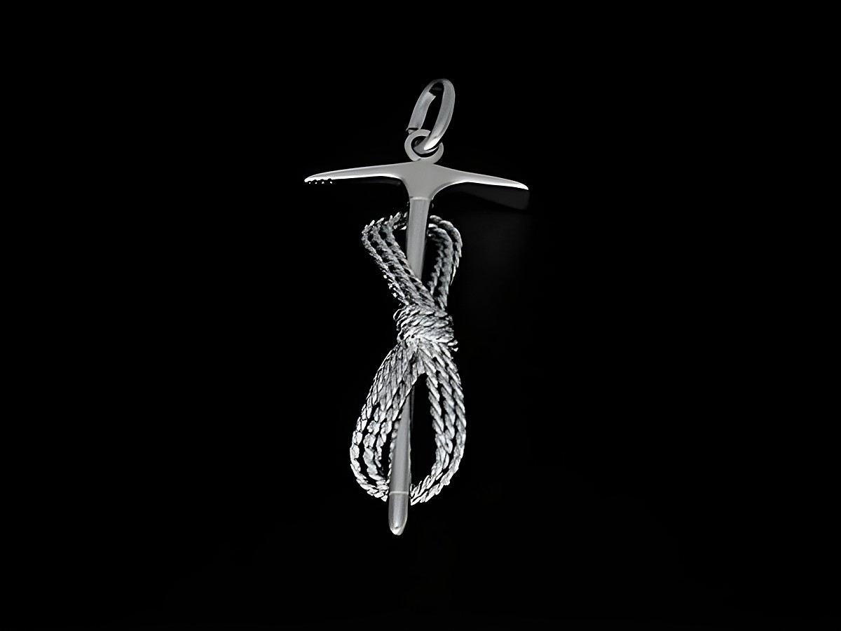 Ein silber rhodinierter Anhänger in Form eines Pickels mit Seil, ideal für Bergsteiger und Sportliebhaber, hergestellt von Juwelier Harnisch.