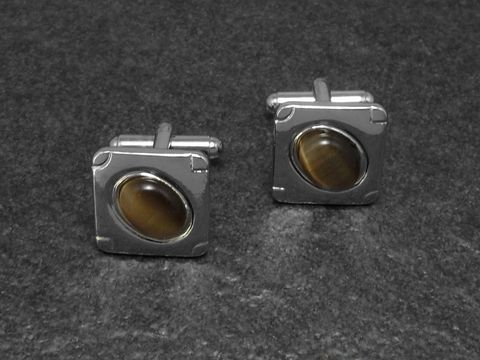 Manschettenknöpfe in braunem Design mit einem Durchmesser von 16,4 mm, silberfarben, Hersteller Juwelier Harnisch, ideal für elegante Anlässe.