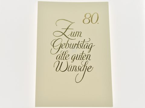 Geburtstagskarte in schlichten Design mit goldener Schrift, elegant gestaltet, mit der Aufschrift Zum Geburtstag alle guten Wünsche sowie der Zahl 80, Hersteller Juwelier Harnisch.