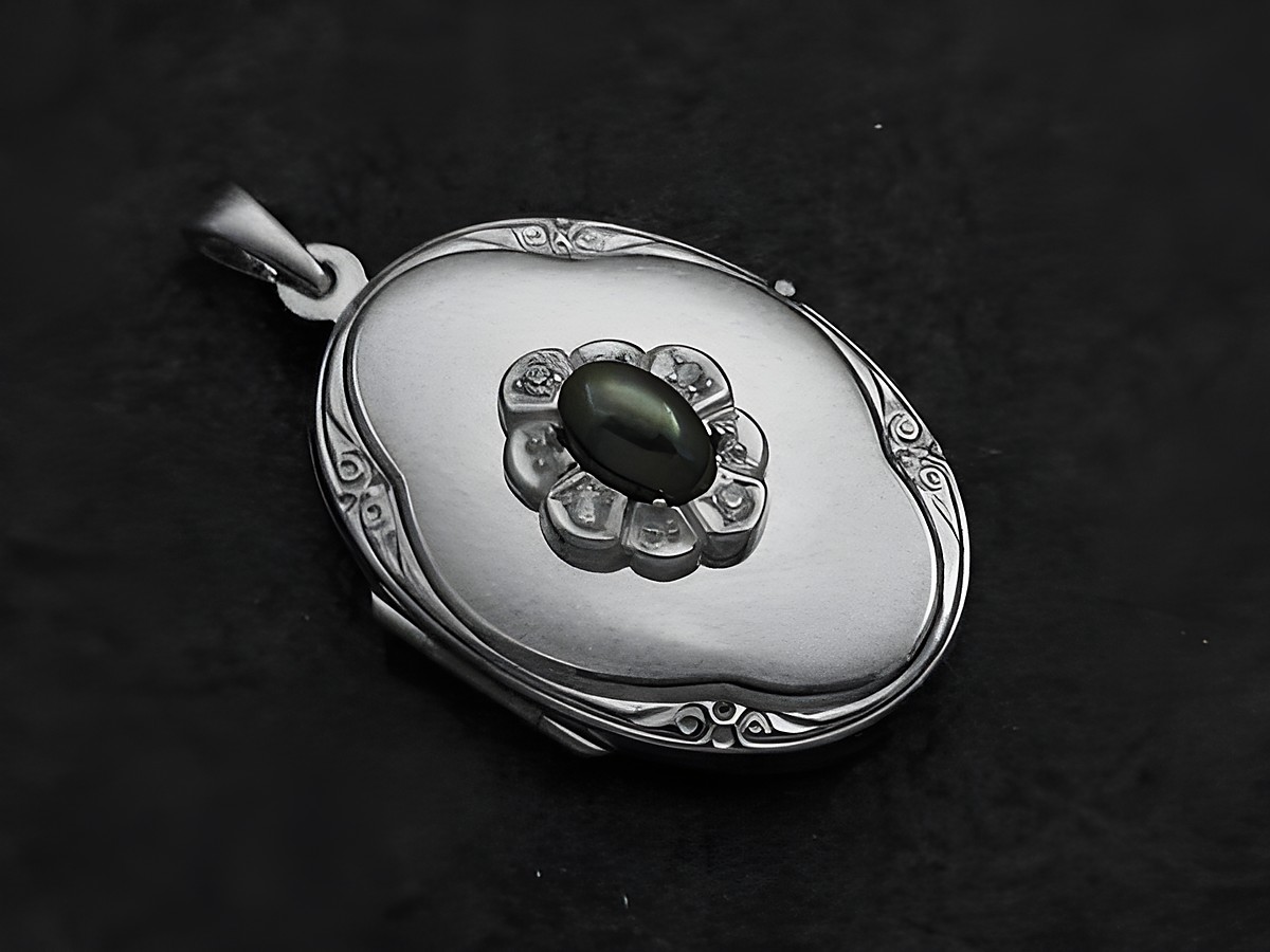 Hämatit grau Medaillon Cabochon in Weißgold 333 mit Brillanten, Hersteller Juwelier Harnisch, elegantes Schmuckstück mit feiner Detailarbeit und ansprechendem Design.