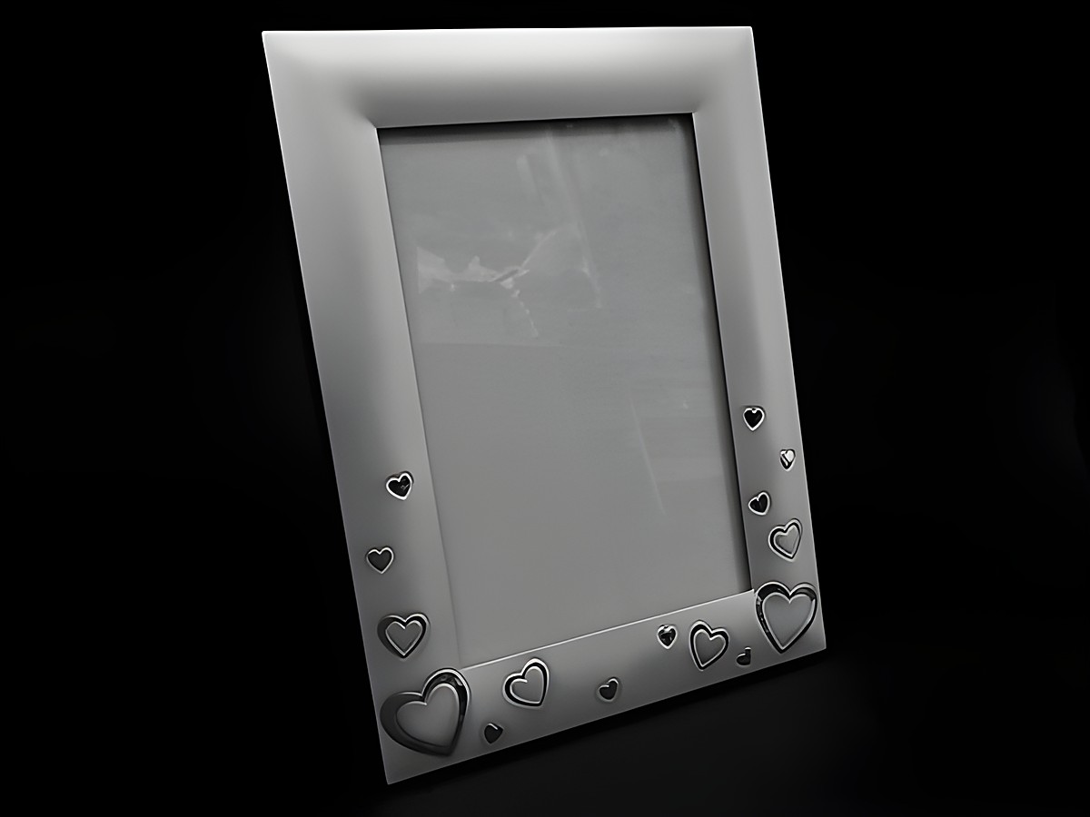 Versilberter Bilderrahmen mit Herzmotiven für Fotogröße 15 x 10 cm, ideal für persönliche Erinnerungen und Dekoration, Hersteller Juwelier Harnisch, elegant und romantisch.