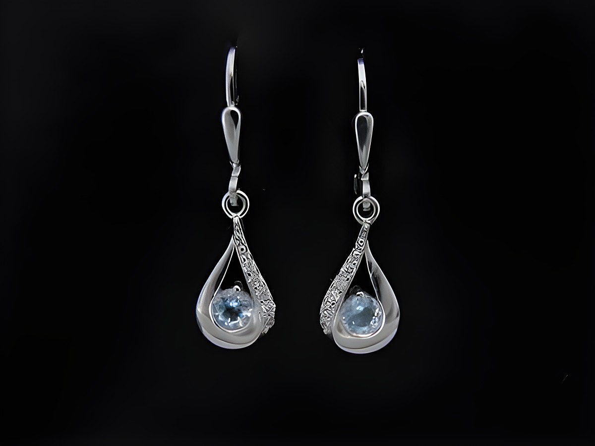 Ohrringe Blue Dreams aus rhodiniertem Sterling Silber mit Blautopas und Zirkonia, eleganter Ohrhänger mit Stein in tropfenförmigem Design, ideal für besondere Anlässe.