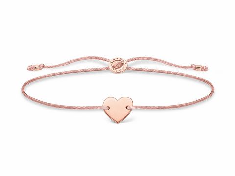 Silbernes Armband mit roségoldenem Herzanhänger, gefertigt aus Nylon in Beige, größenverstellbar von 13 bis 20 cm, aus der Thomas Sabo Charming Collection.