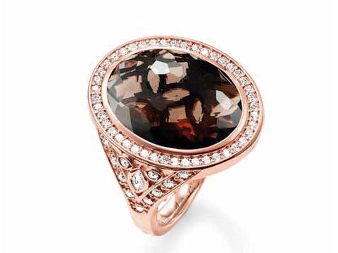 Thomas Sabo Ring aus Sterling Silber mit vergoldetem Roségold, featuring einen ovalen Rauchquarz und Zirkonia-Steinen in braun, Größe 54. Elegantes Design mit funkelndem Detail.