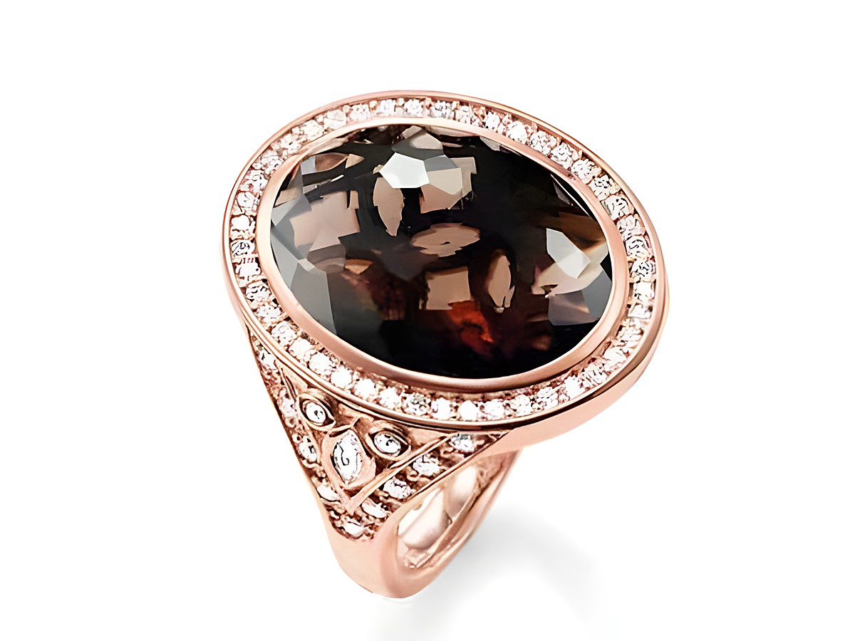 Thomas Sabo Ring aus Sterling Silber mit vergoldetem Roségold, featuring einen ovalen Rauchquarz und Zirkonia-Steinen in braun, Größe 54. Elegantes Design mit funkelndem Detail.