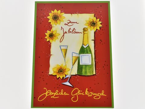Eine Glückwunschkarte zum Jubiläum mit zwei Sektgläsern, einer Sektflasche und Sonnenblumen auf rotem Hintergrund, Hersteller Juwelier Harnisch, Glückwunschkarten.