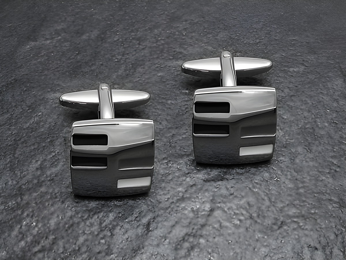 Designer Manschettenknöpfe im 70er Jahre Stil, silberfarben, von Juwelier Harnisch, mit modernem, geometrischem Design. Ideal für elegante Anlässe und modische Akzente.