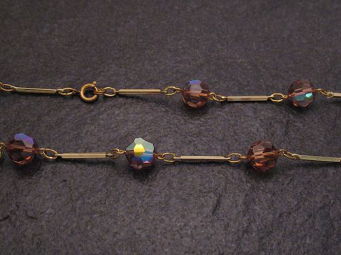 Braune Strasskette 54 cm lang und 10x10 mm breit, mit funkelnden Steinen und goldfarbener Kette, hergestellt von Juwelier Harnisch. Ideal für stilvolle Akzente.