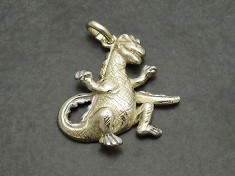 Gold auf Silber Anhänger in Form eines 3D Dinosauriers, gefertigt vom Juwelier Harnisch, detailreich und stilvoll gestaltet, ideal für Dinosaurier-Liebhaber.
