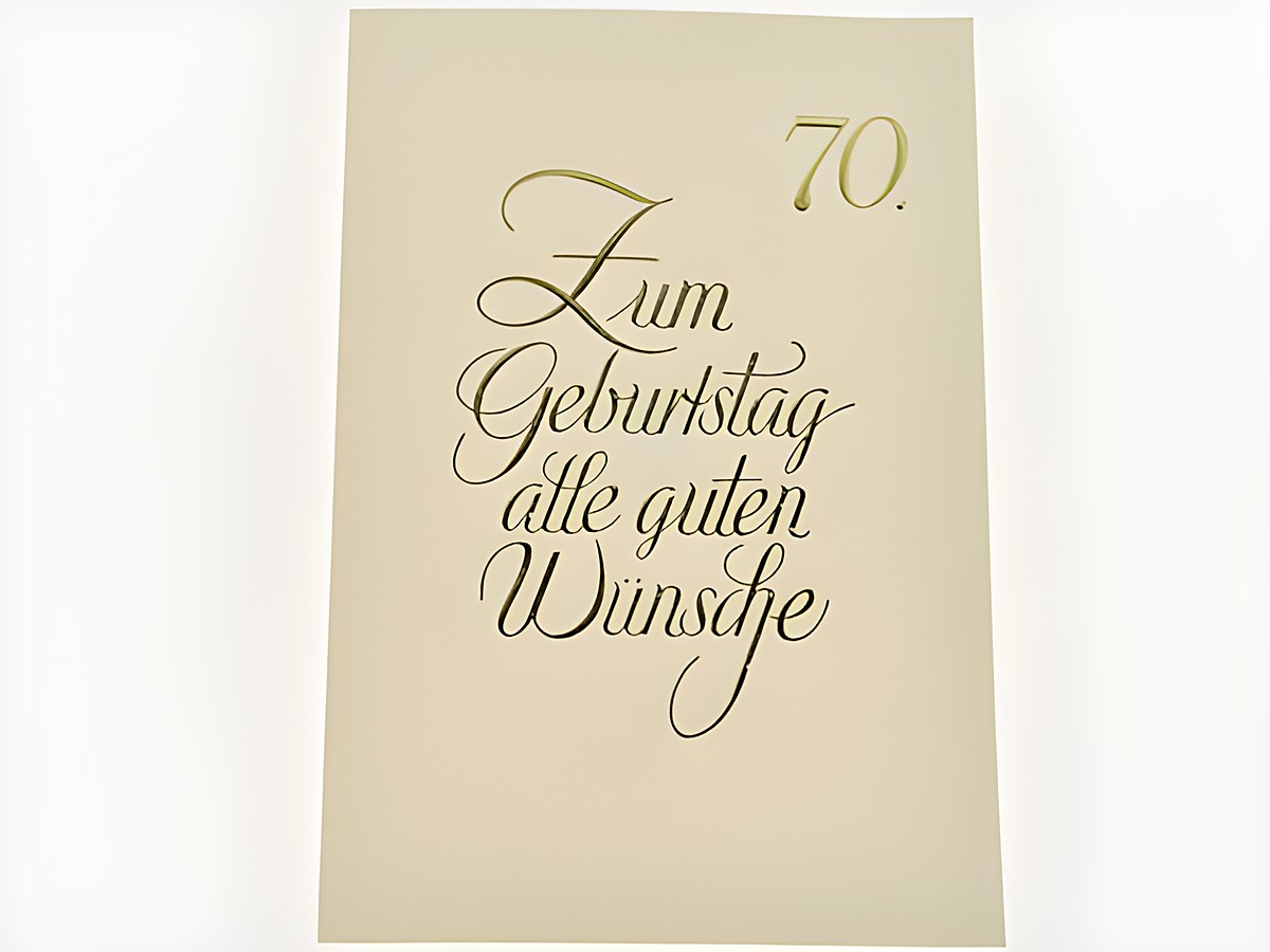 Geburtstagskarte in elegantem Design mit goldener Schrift, auf der steht „70. Zum Geburtstag alle guten Wünsche“, Hersteller Juwelier Harnisch, ideal für besondere Anlässe.