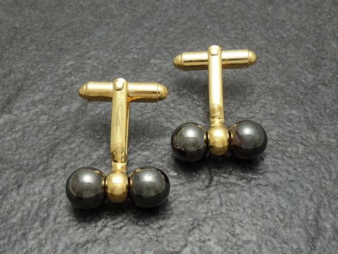 10123-0 Manschettenknöpfe im Hämatit-Look mit vergoldeter Oberfläche von Juwelier Harnisch, goldfarben, elegantes Design, ideal für formelle Anlässe und stilvolle Outfits.