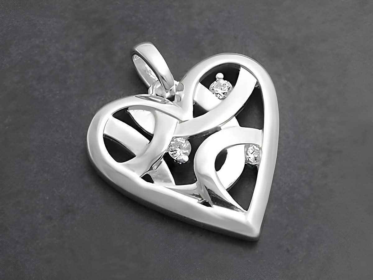 Designherz aus Sterling Silber mit Zirkonia, filigran gearbeitetes Herzmotiv mit offenen Mustern und funkelnden Steinen, bietet eleganten Schmuck für besondere Anlässe, Hersteller Juwelier Harnisch, Perlen und Steine.