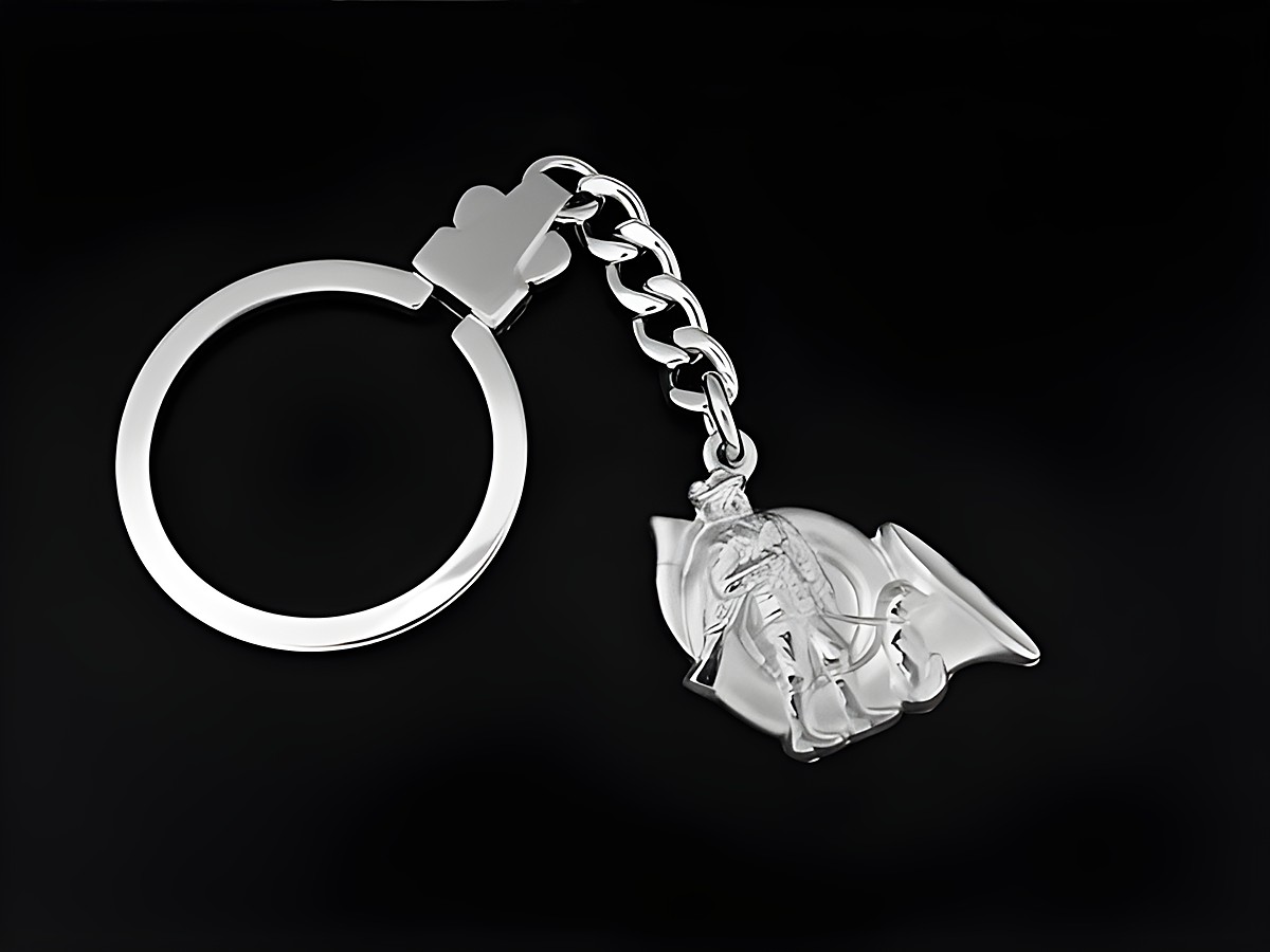 Schlüsselanhänger in Form eines Jägers mit Jagdhorn aus rhodiniertem Sterling Silber, hergestellt von Juwelier Harnisch, ideal als Geschenkidee.