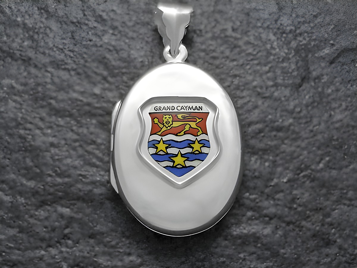Silbermedaillon mit dem Wappen der Kaimaninseln, Grand Cayman, farbig gestaltet mit Löwen und Wellen, gefertigt vom Juwelier Harnisch, ideal für Sammler und als Reiseandenken.