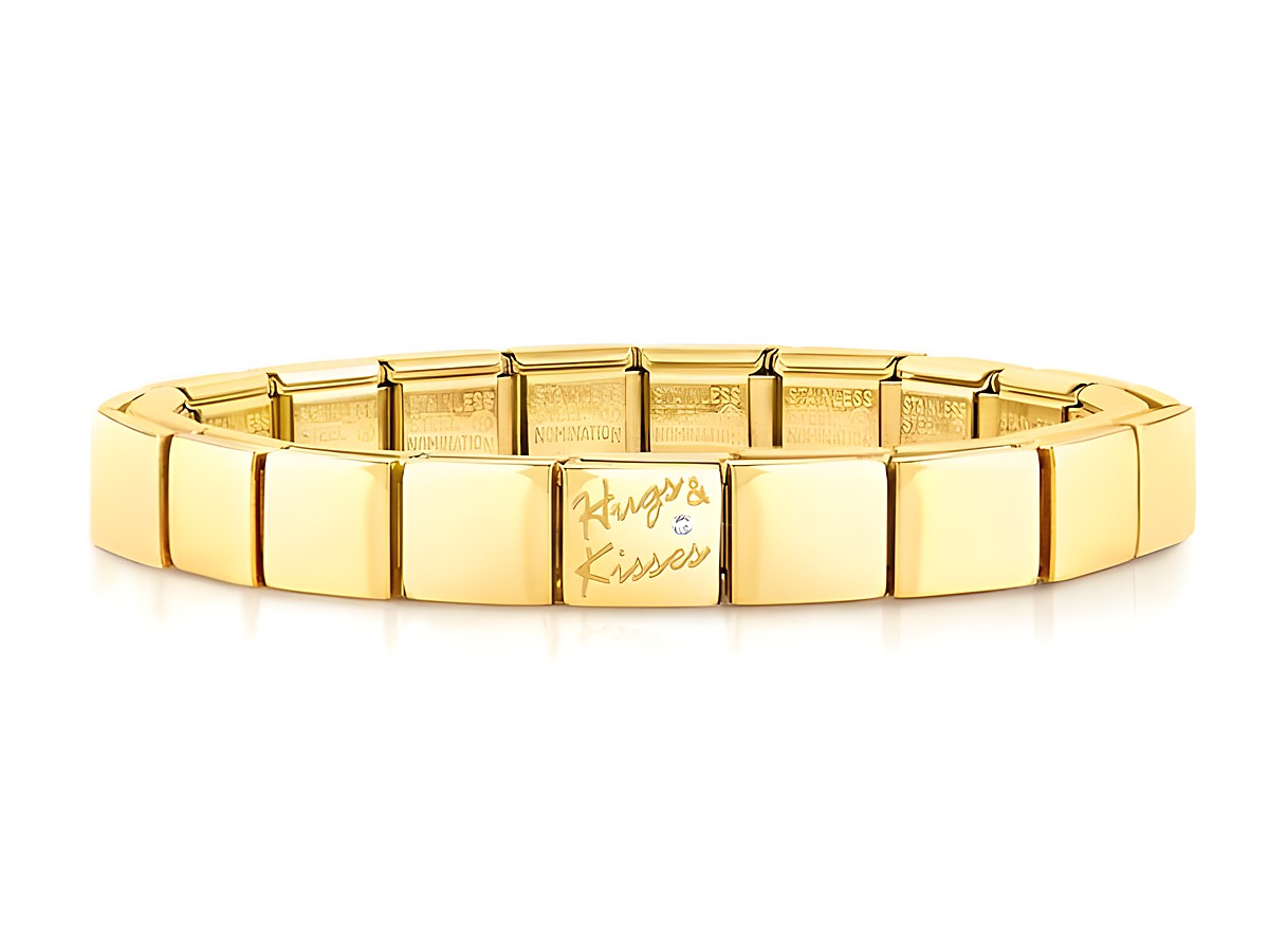 Edelstahl Armband in Gelbgold PVD-beschichtet mit der eingravierten Aufschrift Hugs and Kisses, entworfen von Nomination, elegantes Design für jeden Anlass.