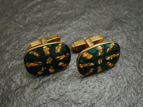 Manschettenknöpfe SUN grün-gelb aus Emaille, vergoldet, Hersteller Juwelier Harnisch, ovales Design mit goldenen Akzenten auf grünem Hintergrund, stilvolles Accessoire für Herren.