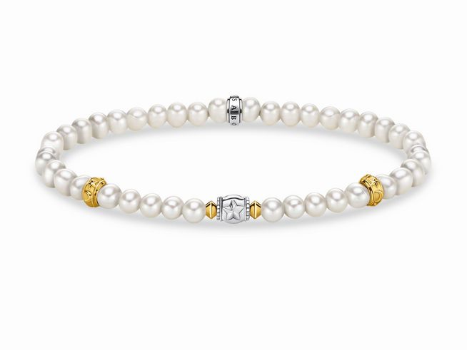 Vergoldetes Armband von Thomas Sabo, Modell A1979-430-14, mit Perlen und eleganten Schmuckelementen in Gelbgold und Silber, Länge 15,5 cm, erweitert bis 16 cm.