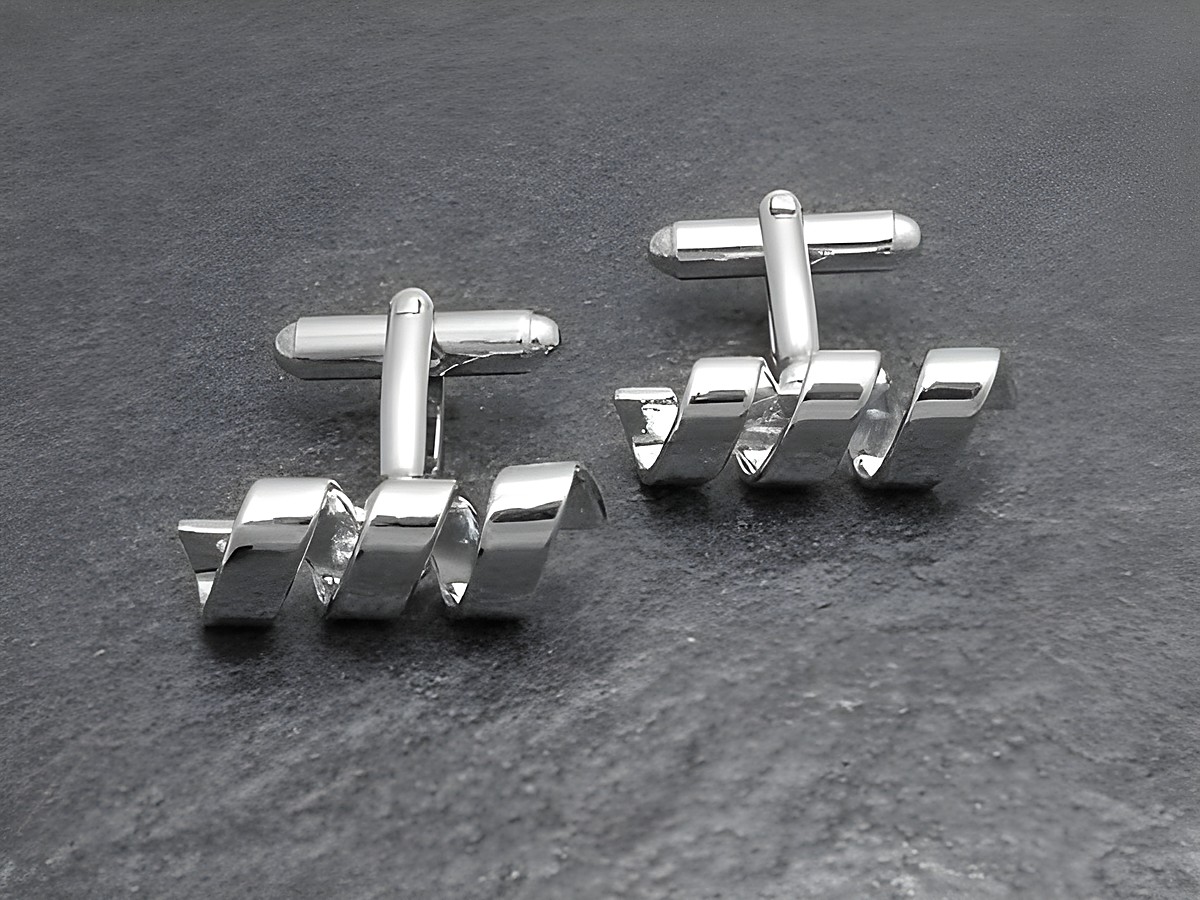 Moderne silberfarbene Manschettenknöpfe im Helix Look des Herstellers Juwelier Harnisch, elegant und stilvoll, ideal für formelle Anlässe.