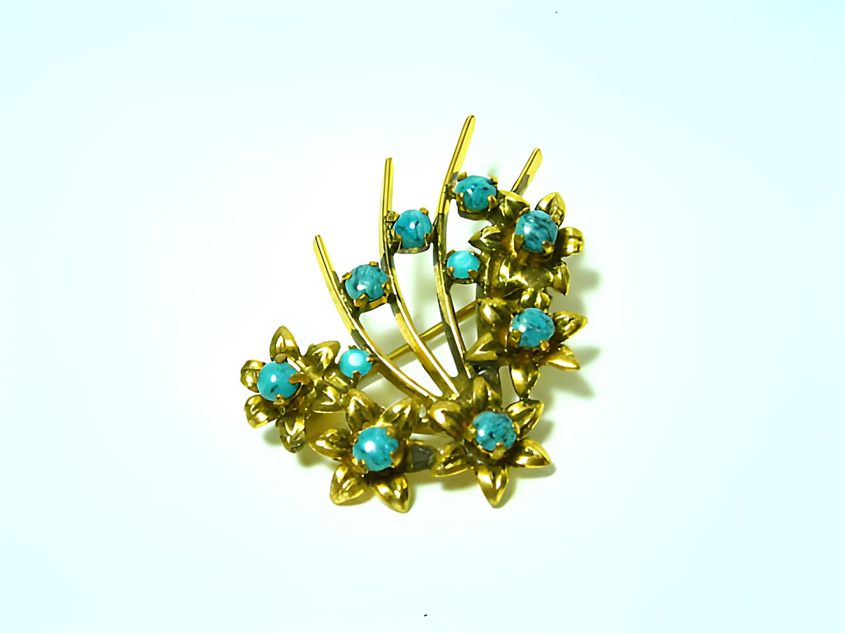 Wunderschöne Brosche in Türkis mit gefassten Steinen, neu vom Juwelier Harnisch, im eleganten Blumen-Design, ideal für einen besonderen Look.