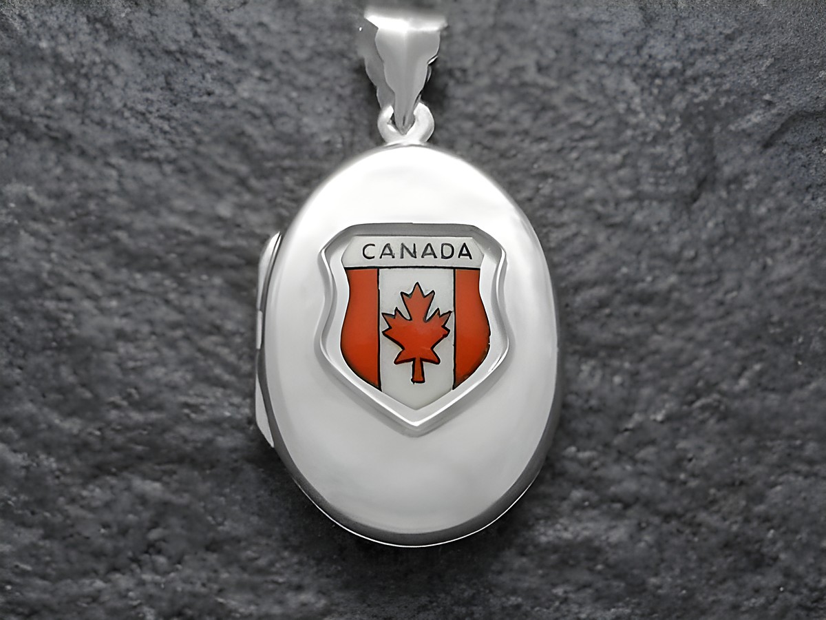 Silber Medaillon mit dem Wappen von Kanada, das den Schriftzug Canada und einen roten Ahornblatt zeigt, Hersteller Juwelier Harnisch. Ideal für Sammler und Liebhaber kanadischer Symbolik.