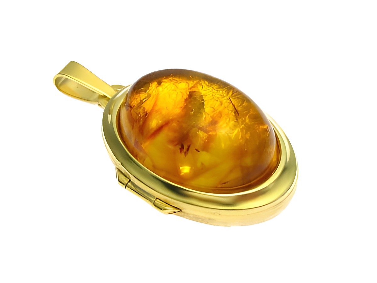 Bernstein Medaillon mit Cabochon in Gold 750, hergestellt von Juwelier Harnisch, hochwertiges Schmuckstück mit einem warmen, goldenen Farbton und feinem Design.