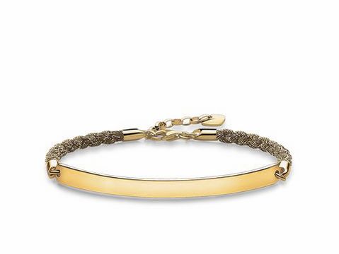Silbernes Armband von Thomas Sabo mit vergoldeter Plakette und Nylonband in Champagnerfarbe, verstellbare Länge von 16,5 bis 19,5 cm. Elegantes und modernes Design.