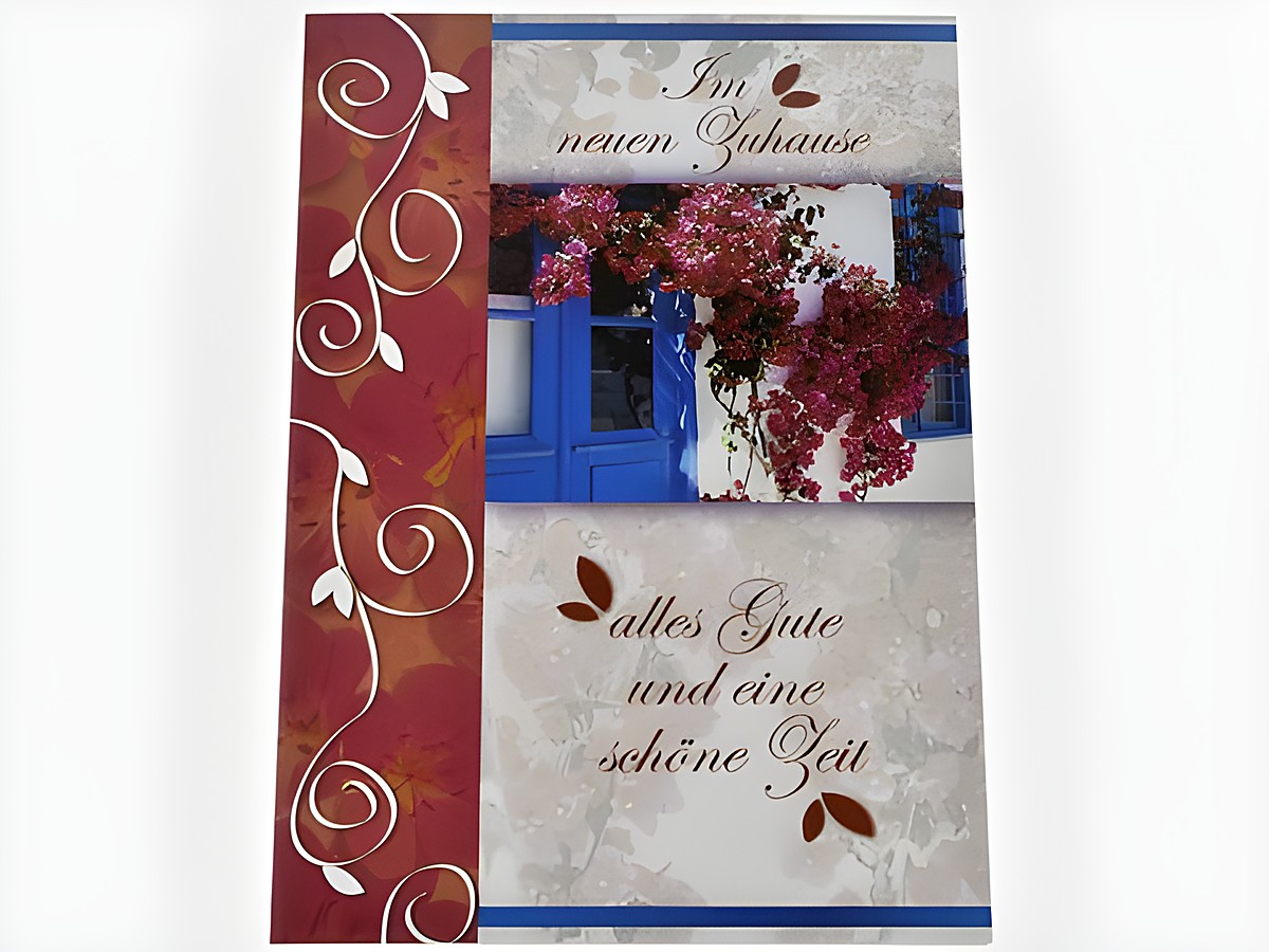Blaue Tür mit Blumenstrauch und dekorativem Design, auf der Grußkarte steht der Text im neuen Zuhause alles Gute und eine schöne Zeit, Hersteller Juwelier Harnisch.