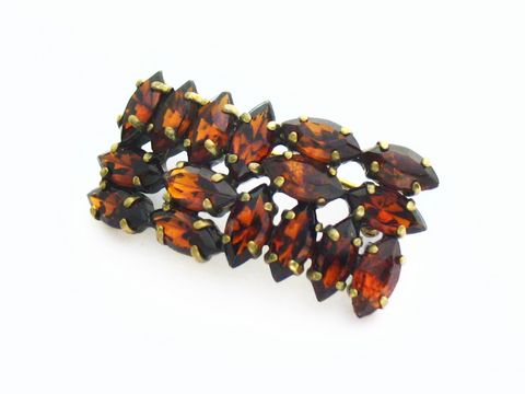 Elegante Braun Strass Brosche im Sexy City Look, hergestellt von Juwelier Harnisch, mit gelben und braunen Steinen, ideal für modische Akzente.