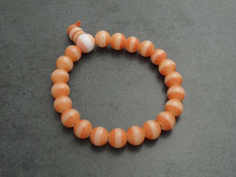 Powerarmband mit Gummizug in Orange, Durchmesser 15 cm, aus Glasstein, elegant und flexibel, ideal für den täglichen Gebrauch, Hersteller Juwelier Harnisch, Powerarmbänder.