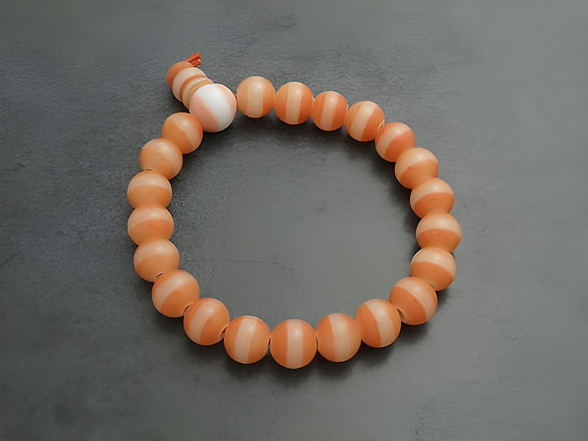 Powerarmband mit Gummizug in Orange, Durchmesser 15 cm, aus Glasstein, elegant und flexibel, ideal für den täglichen Gebrauch, Hersteller Juwelier Harnisch, Powerarmbänder.