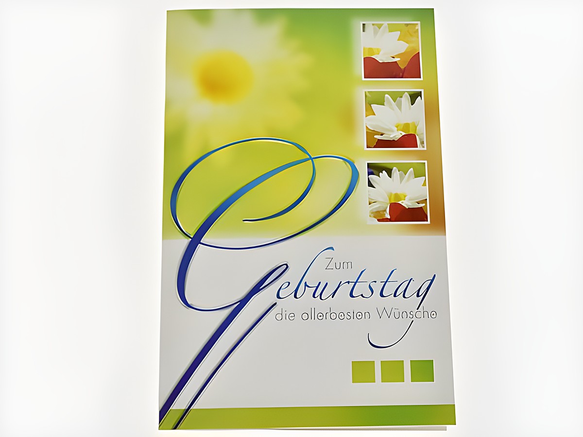 Geburtstagskarte mit weißen Blüten und bunten Akzenten, der Text zum Geburtstag und die besten Wünsche sind dekorativ gestaltet. Hersteller ist Juwelier Harnisch.