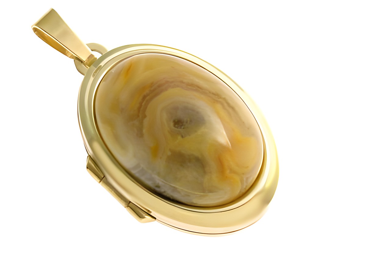 Mexikanischer Achat in ovaler Form, umrahmt von edlem Gold 333, sorgt für einen eleganten Look. Hersteller: Juwelier Harnisch, perfektes Schmuckstück für besondere Anlässe.