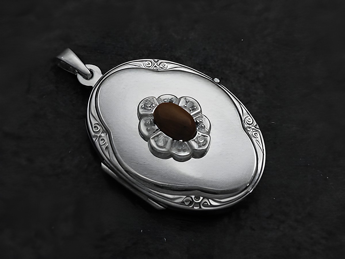 Medaillon aus Weißgold 585 mit Mahagoni Obsidian Cabochon in der Mitte und umgeben von glänzenden Zirkonen, hergestellt von Juwelier Harnisch, elegantes und zeitloses Design.