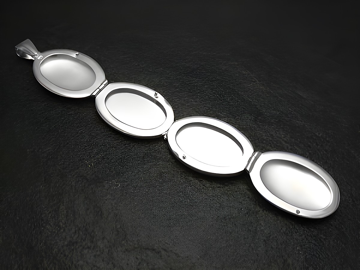Medaillon aus 925 Sterling Silber für vier Bilder, ovaler Form, vom Hersteller Juwelier Harnisch, mit schlichten, eleganten Fächern zum Einlegen von Fotos. – Ansicht 2
