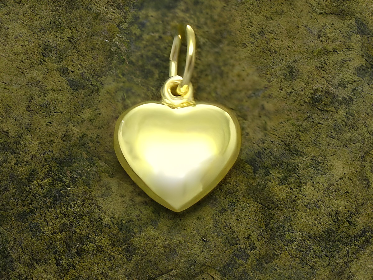 Herzanänger aus gold mit plastischer Form und einem Durchmesser von 10 mm vom Hersteller Juwelier Harnisch. Der Anhänger hat einen glänzenden Oberflächenfinish.