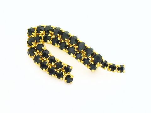 Strass Brosche in Schwarz - Länglich - Gefasst, Hersteller: Juwelier Harnisch, elegante Brosche mit funkelnden schwarzen Strasssteinen in goldener Fassung. Ideal für besondere Anlässe.