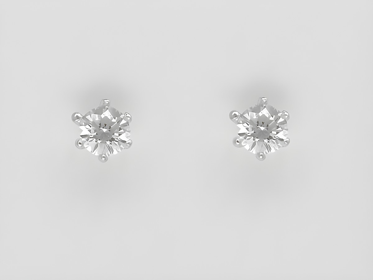 Weißgold Ohrringe in Krappenfassung, zauberhaft, mit einem Brillant von 0,20 ct W/Si, Steckerdesign, Hersteller Juwelier Harnisch, edles Schmuckstück für jeden Anlass.