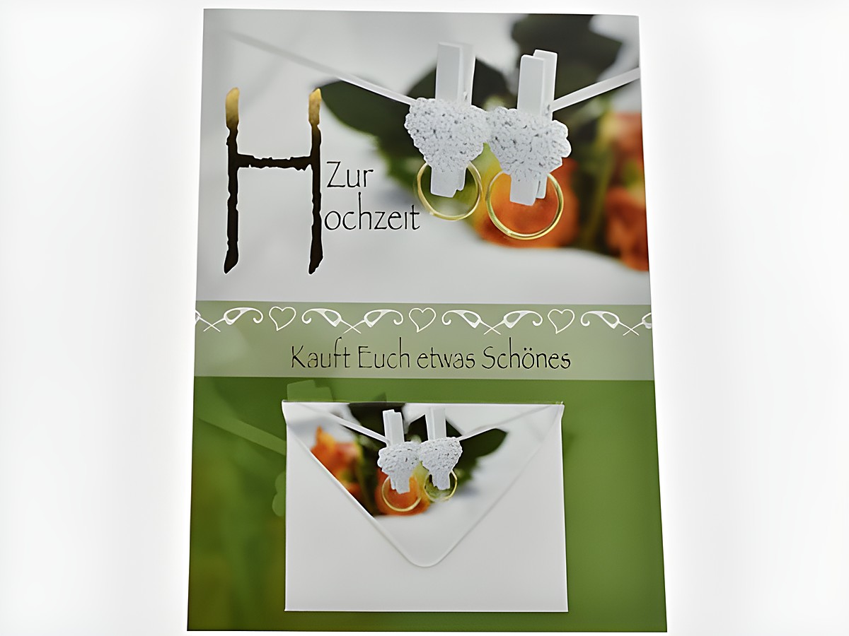 Hochzeitskarte mit kleinen Ringen, die an einer Wäscheleine hängen, und einem Umschlag. Auf der Karte steht Zur Hochzeit und Kauft Euch etwas Schönes. Hersteller ist Juwelier Harnisch.
