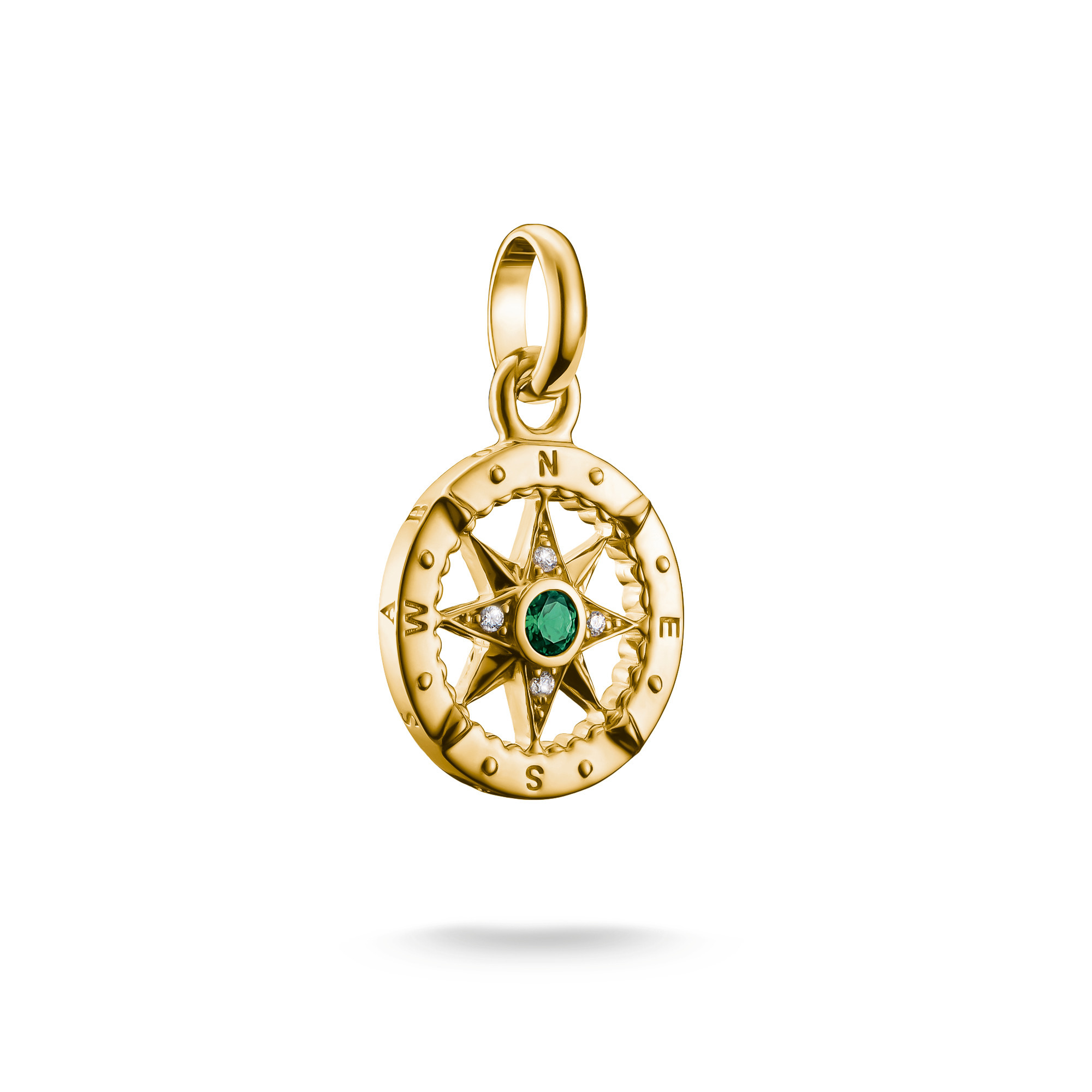 Charm Kompass von Thomas Sabo aus 18k Gelbgold mit Zirkonia und einem grünen Nanokristall. Der Anhänger zeigt eine detailreiche Kompassrose mit Hängeöse. Neuheit im Sortiment.