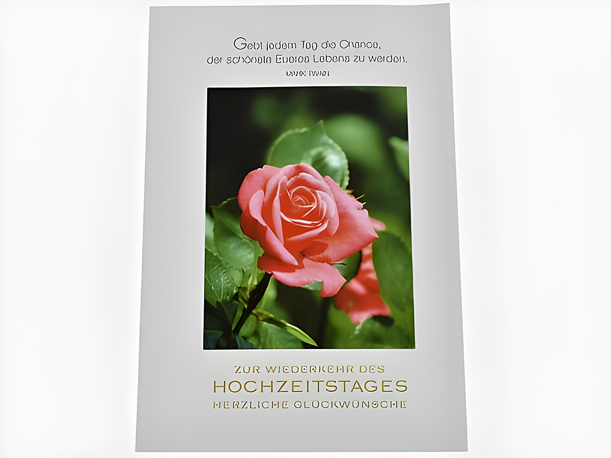 Hochzeitskarte mit einer rosa Rose und dem Schriftzug zur Wiederkehr des Hochzeitstags sowie herzlichen Glückwünschen, Hersteller Juwelier Harnisch.