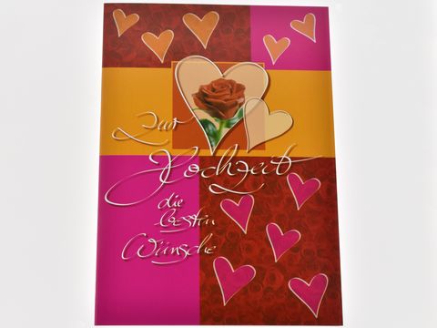 Hochzeitskarte in verschiedenen Rottönen mit Herzen und einer roten Rose, dekoriert mit der Aufschrift zur Hochzeit die besten Wünsche, Hersteller Juwelier Harnisch.