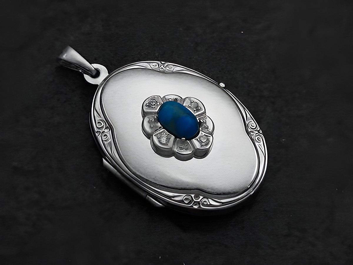 Howlite türkis Medaillon Cabochon aus Sterling Silber mit Zirkonia, oval gestaltet und in einer filigranen Blütenform umgeben, geeignet als elegantes Schmuckstück.