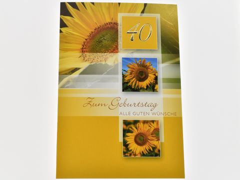 Eine Geburtstagskarte mit der Aufschrift "Zum Geburtstag" und "40". Die Karte hat ein gelbes Design mit einer Sonnenblume und zwei Bildern von Sonnenblumen. Hersteller: Juwelier Harnisch.