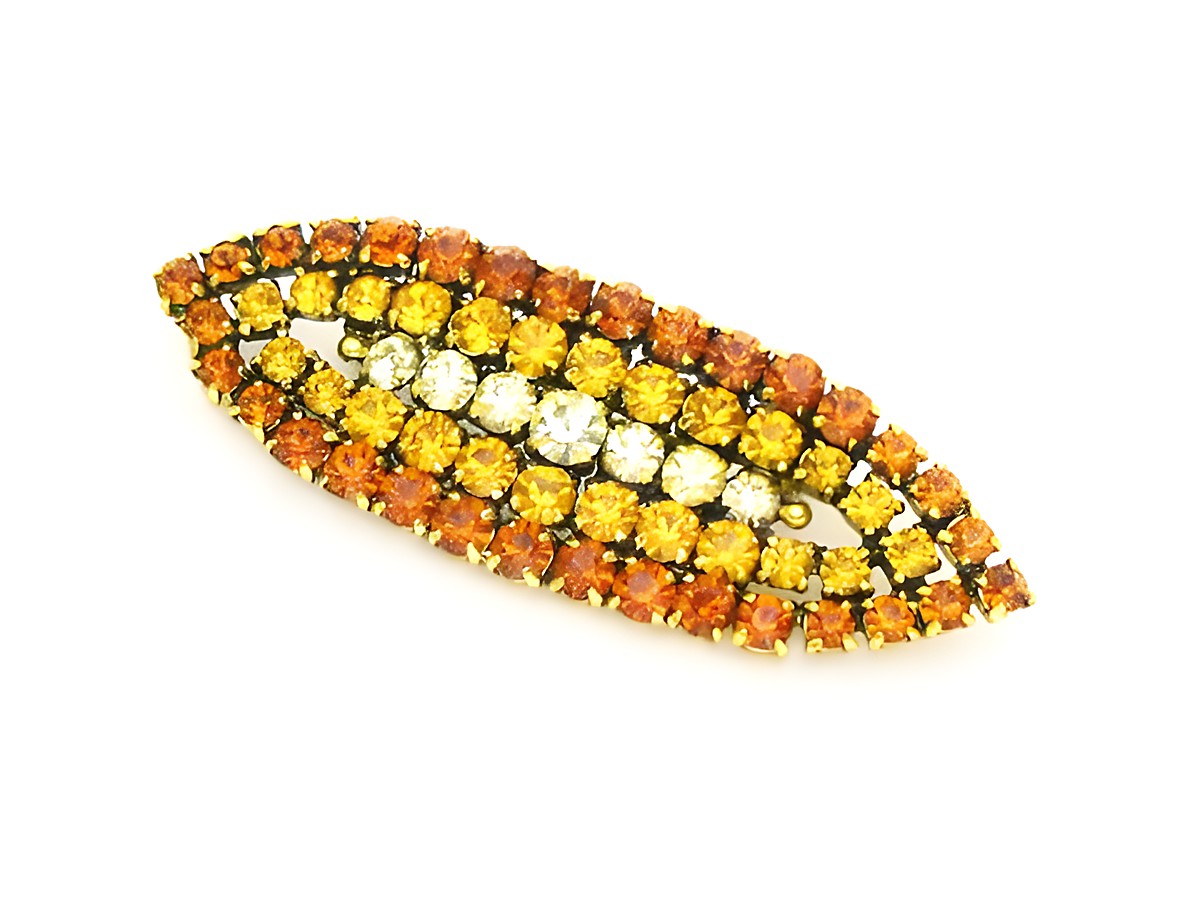 Brosche Sexy City Look Einzelstück in Orange, hergestellt von Juwelier Harnisch. Strass Brosche in Gelb und Braun mit glitzernden Steinen in mehreren Reihen angeordnet, ideal für auffällige Outfits.